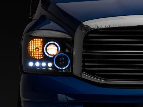 Raxiom 06-08 Dodge RAM 1500 LED Halo Projector Headlights- Black Housing (Clear Lens)