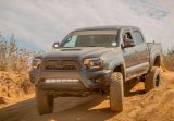 Cali Raised 05-15 Toyota Tacoma Low Prof Ditch Light Brackets Kit W/ Amber Backlight - Tall thumbnail 1