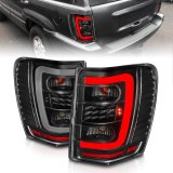 ANZO 1999-2004 Jeep Grand Cherokee LED Tail Lights w/ Light Bar Black Housing Clear Lens thumbnail 1